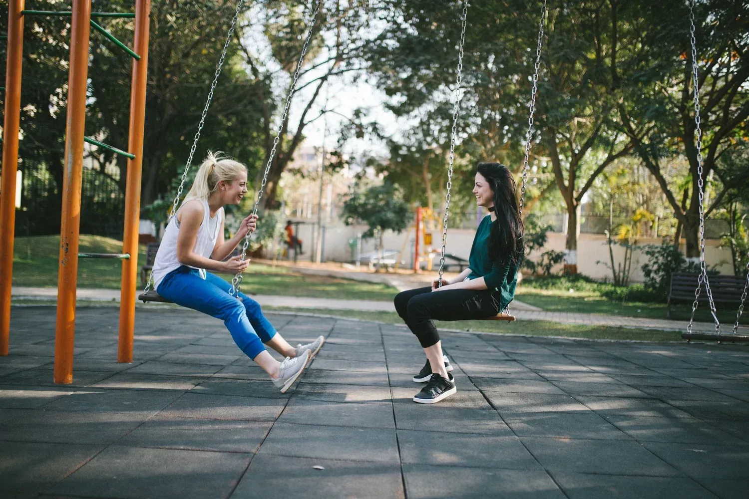 Two students on a swing playing the categories game to practice their articulation