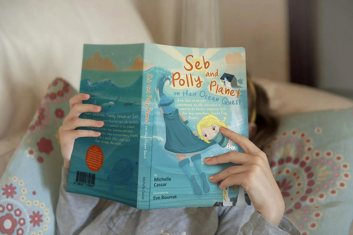 5 year old reading "Seb and Polly Planet" during a speech therapy session in San Diego