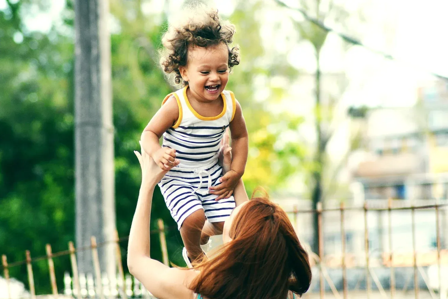 Mom playing with 2 year old in Solana Beach during a play based speech and language therapy session